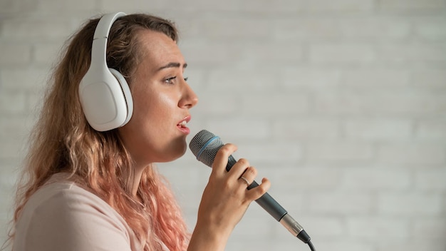Professional vocal training instructor demonstrating singing techniques during lessons