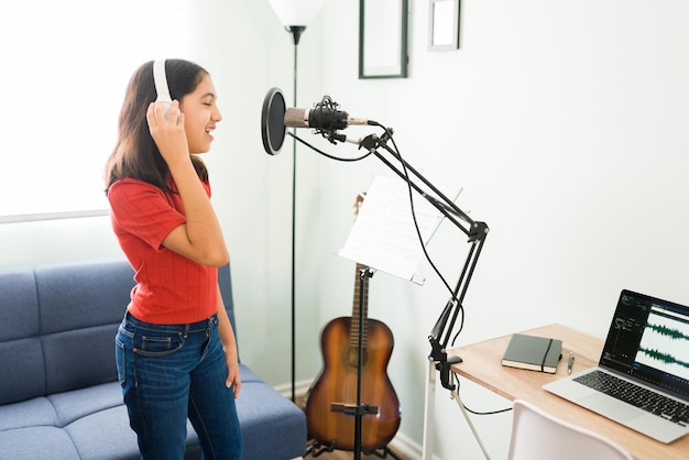 Professional vocal instructor demonstrating singing techniques during music lessons